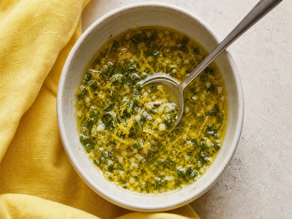 Lemon zest, garlic, oregano, and thyme stirred into olive oil